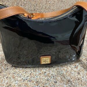 D&B. Dooney Bourke
Black patent leather